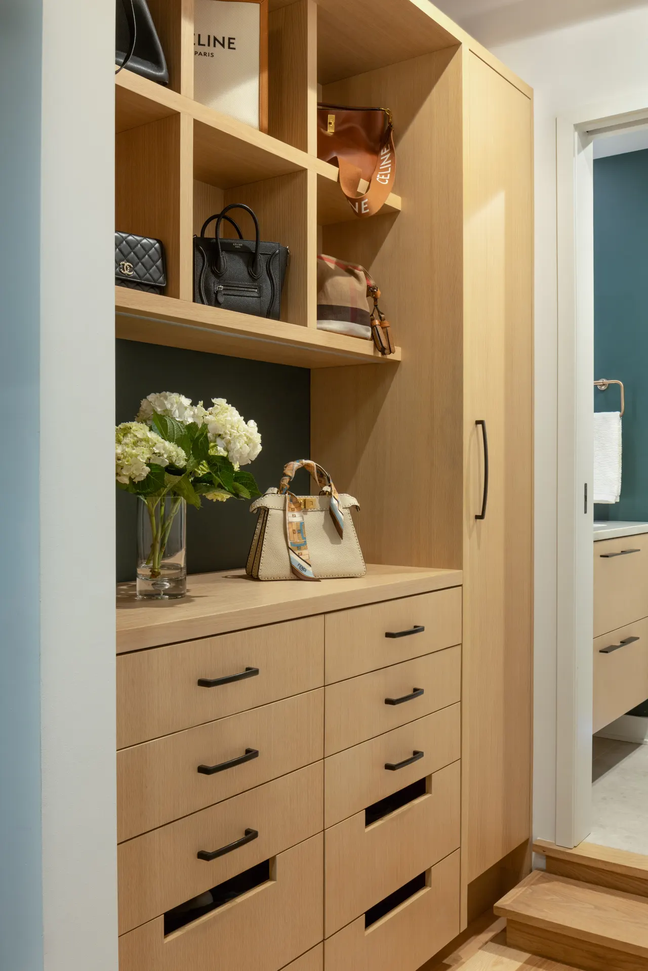 Custom closet built-ins with open shelving and drawers